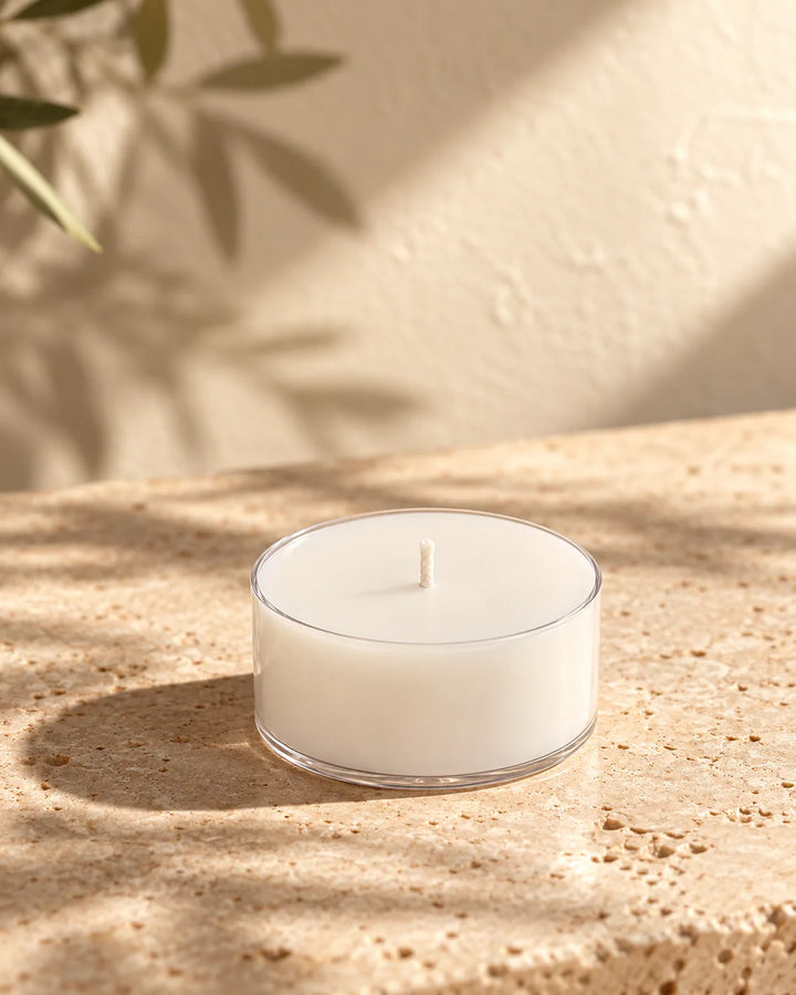 Vela de té ZAEVA sin aroma en recipiente transparente