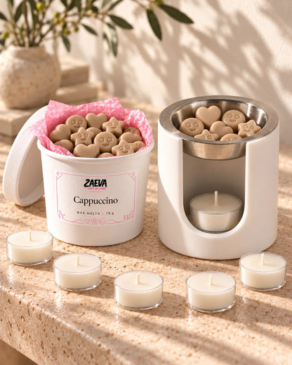 Quemador ZAEVA Nido con wax melts y velas de té del pack Primer Ritual sobre una encimera